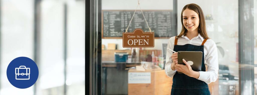 Business owner reviewing their commercial insurance policy with a specialist.