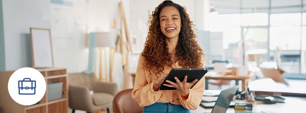 Realistic photograph of business owners reviewing their Business Owners Policy (BOP) documents in a modern professional setting.