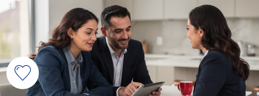 latin couple meeting insurance agent at kitchen table reviewing coverage documents