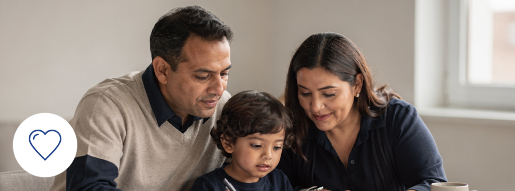 Latin family reviewing documents at home planning term life insurance together